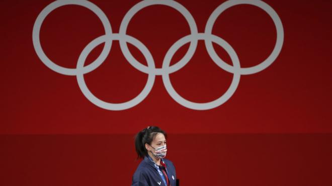 Golden medalist Hsing-Chun Kuo of Chinese Taipei at the podium after the Women"s 59kg Group A competition during the Weightlifting events of the Tokyo 2020 Olympic Games at the Tokyo International Forum in Tokyo, Japan, 27 July 2021