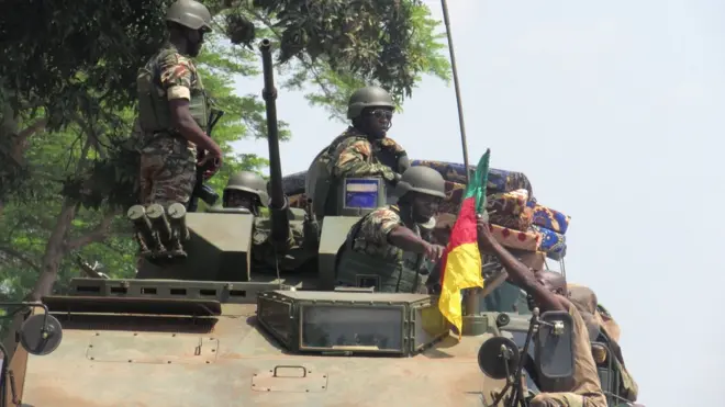 Cameroonian military on top tanker.
