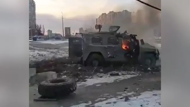 A screen grab captured from a video shows a Russian armoured vehicle burning after it was destroyed by Ukrainian forces in Kharkiv, Ukraine, on 27 February 2022