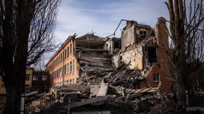 This photograph taken on March 4, 2022 shows a school building damaged in yesterday's shelling in the city of Chernihiv. -