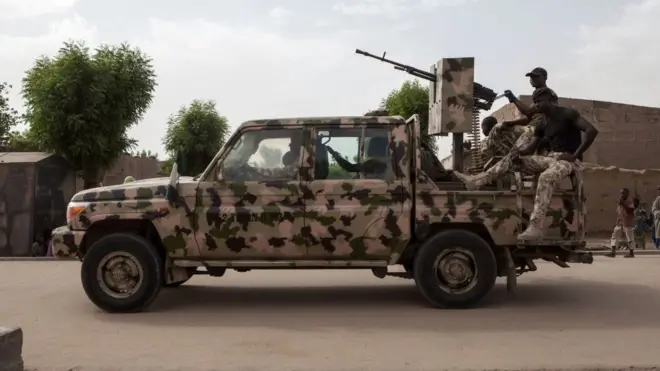 Nigeria army officers inside dia van.