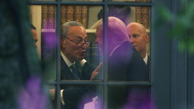 Senate Minority Leader Chuck Schumer and Donald Trump share a moment in the Oval Office.