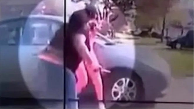 The footage appears to show Ma'Khia Bryant lunging with a sharp object