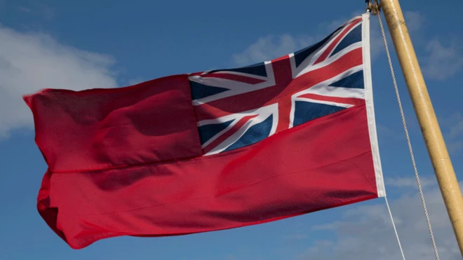 The Red Ensign flag is flown on British vessels at sea