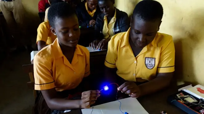 Princess Makafui and her friend use the science kit