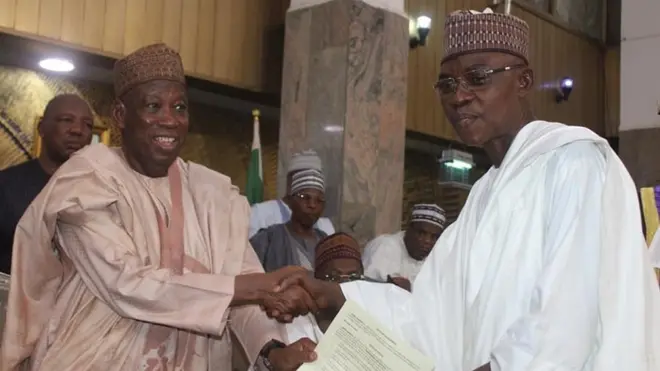 Governor Ganduje and one of di perm secs after swearing in