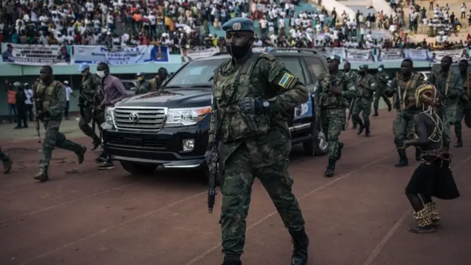 CAR President Faustin Archange Touadéra was seen at an election rally escorted by the presidential guard and Rwandan UN peacekeepers