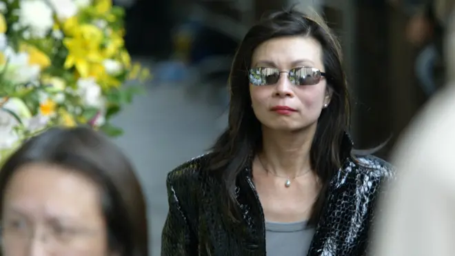 Lu Ping, Director of Kwang Hwa Information & Culture Centre, attends the funeral service for the Canto-pop diva, Anita Mui Yim-fong, held at Hong Kong Funeral Home in Quarry Bay. 12 January 2004