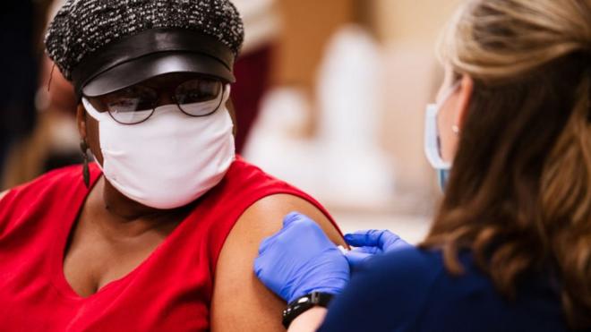 A woman is vaccinated in Kentucky, 20 January 2021