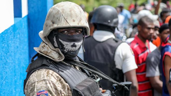 Haitian solder with a skull face mask