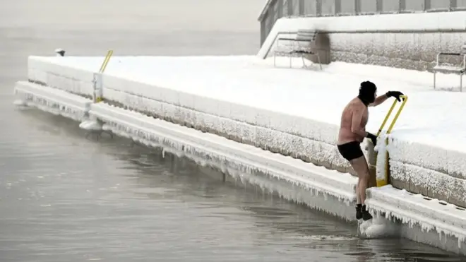 This man was not prepared to give up his swim in Helsinki, although some places in Finland have recorded their lowest winter temperatures