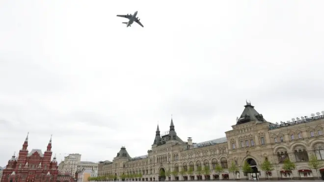 A Russian military plane flies over the Kremlin