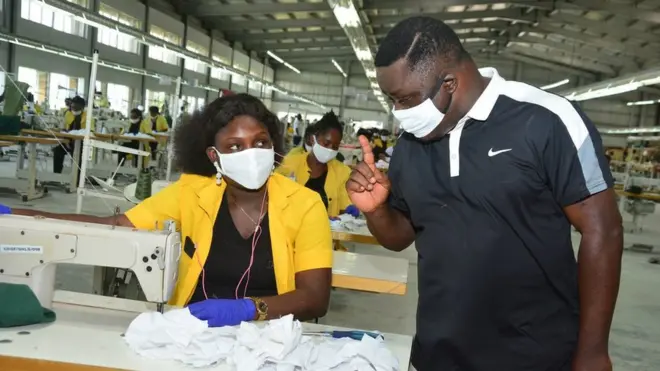 Ben Ayade for di garment factory with worker