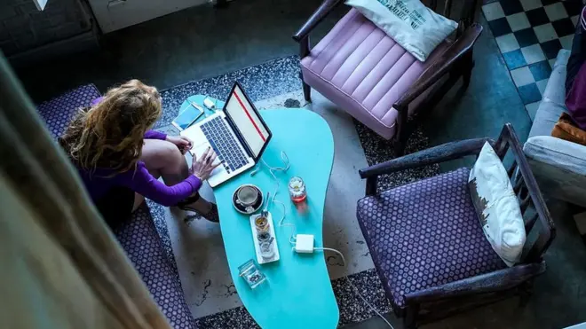 women using laptop at home