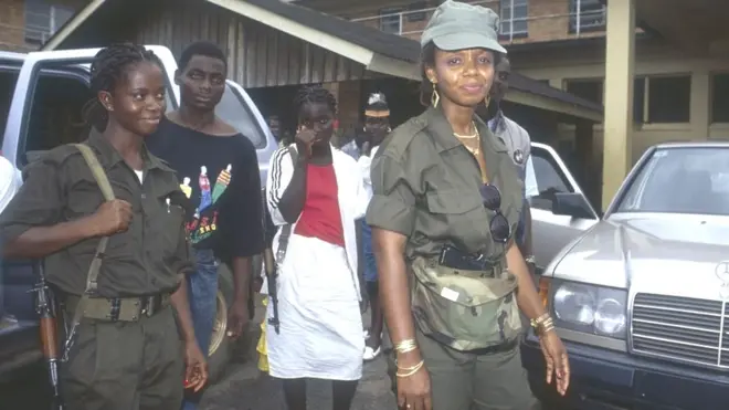 Agnes Taylor (far right) face accuse say she follow join di pipo wey use rape to torture women during di 1990 war