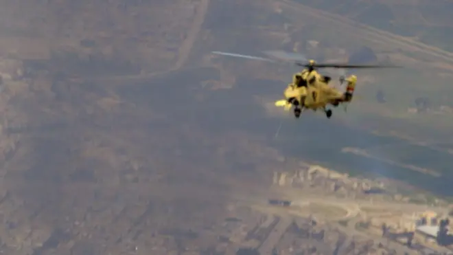 A helicopter fires on ISIS fighters in Mosul