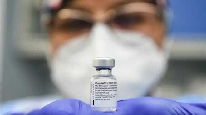 A Cremona Hospital health worker holds a bottle of Pfizer/BioNTech COVID-19 vaccine