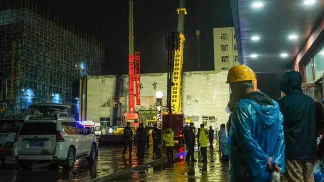 Rescuers work at a school gym after the roof of the building collapsed in Qiqihar, in China's north-eastern Heilongjiang province early on July 24, 2023.