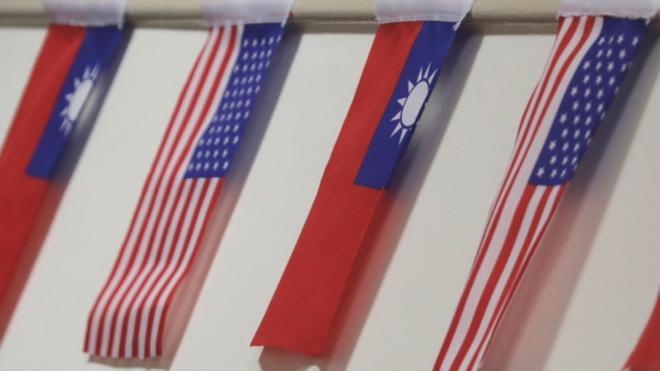 The flags of Taiwan and USA are on display during the ceremonial opening of the "Taiwan Council for US Affairs" office in Taipei,