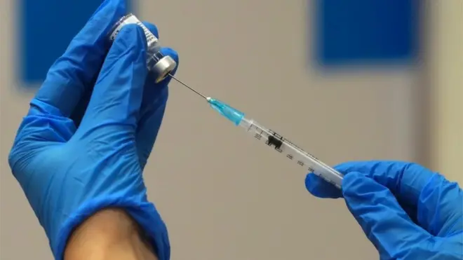 A medical worker prepares a vaccine against the coronavirus disease in Jerusalem