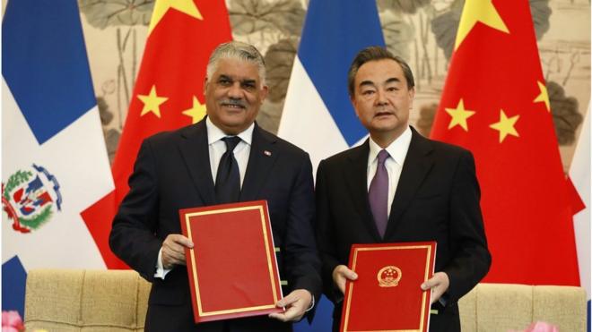 Dominican Republic Foreign Minister Miguel Vargas (L) and China"s Foreign Minister Wang Yi show documents after a signing ceremony where they formally established diplomatic relations between the two countries at Diaoyutai State Guest-house in Beijing, China, 01 May 2018. The Dominican Republic announced 01 May 2018 that they are establishing formal diplomatic relations with China and breaking diplomatic ties with Taiwan. EPA/HOW HWEE YOUNG