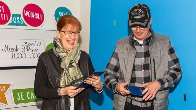 Nicole Pedneault and Roger Larocque collecting their prize