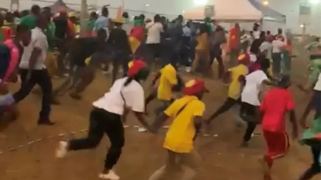 A video showed fans running past a checkpoint outside the stadium before the crush