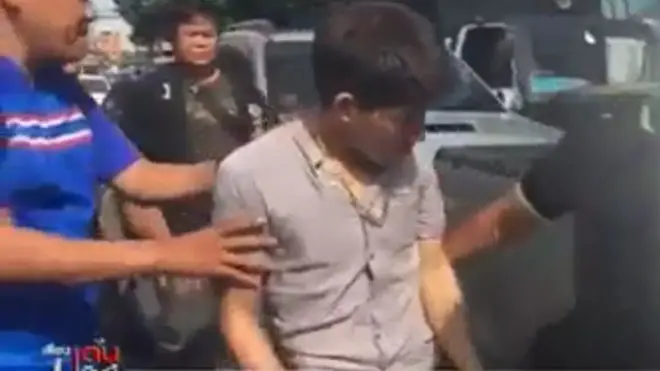 Nghi phạm Lê Đức Lộc bị dẫn giải về đồn cảnh sát