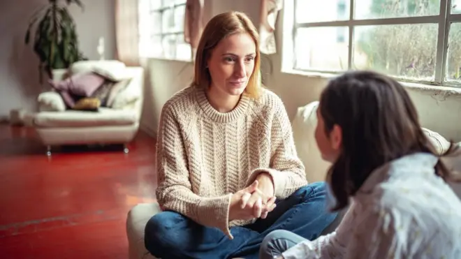 Mother and daughter having a conversation