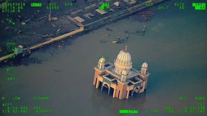 Taken from a government survey aircraft, this mosque can be seen stranded amid floodwater.