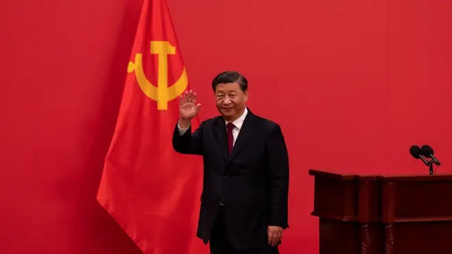 General Secretary and Chinese President, Xi Jinping waves as he leaves after speaking at a press event with members of the new Standing Committee of the Political Bureau of the Communist Party of China and Chinese and Foreign journalists at The Great Hall of People on October 23, 2022 in Beijing, China.