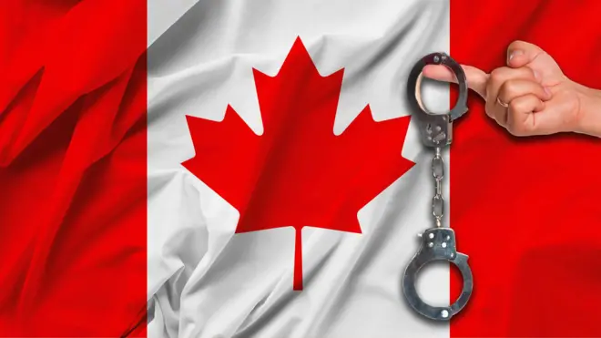 Canada flag wit pesin hand wey dey hold handcuff