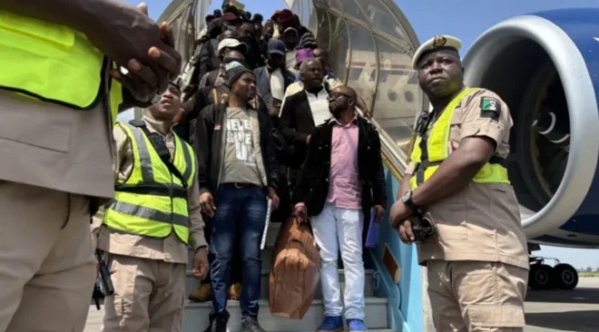 Nigerians from South Africa deborading from a plane after landing at the Lagos International Airport