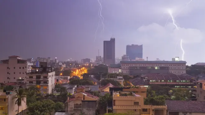view of the skyline Colombo (Sri Lanka), night scene with a strong thunderstorm and hard rain. seen by the strong thunderstorm lightning, the rain drops