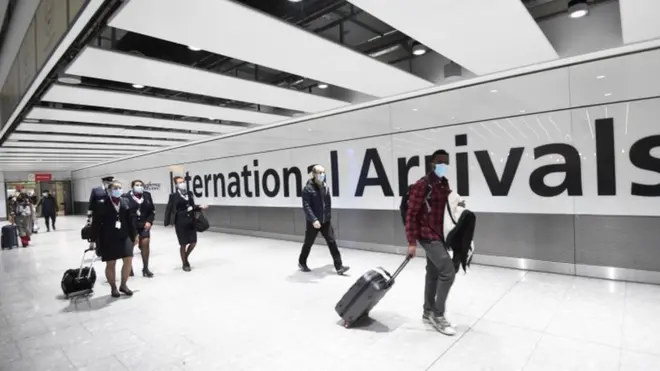 Travellers arrive at London's Heathrow Airport