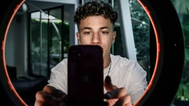 French TikToker Rafael Caplan recording a video