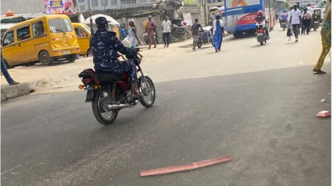 Police man ontop okada on day one of ban
