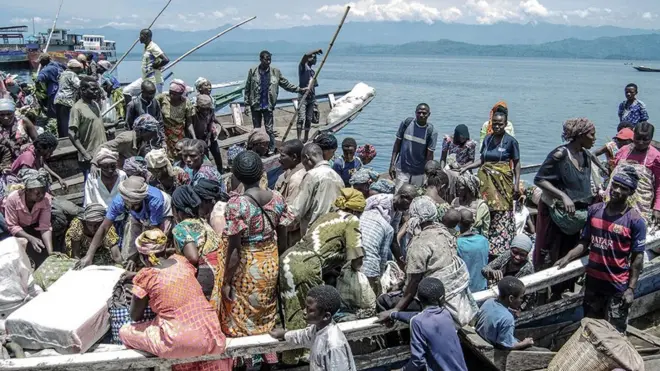 Vendors and shoppers at Kituku market on the shores of Lake Kivu in Goma