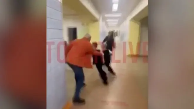 Footage shows pupils evacuating as a shooting leaves at least 13 people dead and 21 injured.