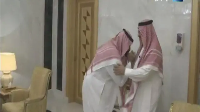 The new crown prince, Mohammed bin Salman, kisses Prince Mohammed bin Nayef’s hand, then briefly kneels down in front of him