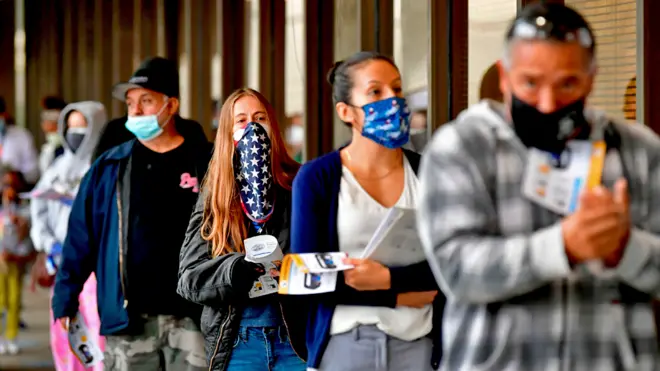 Voters queue to vote at the Los Angeles County Registrar in Norwalk, California
