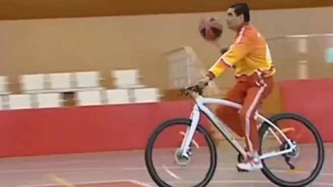 The video shows the Turkmen president playing basketball on a bicycle and lifting weights