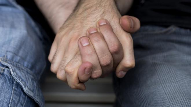 File photo of men holding hands
