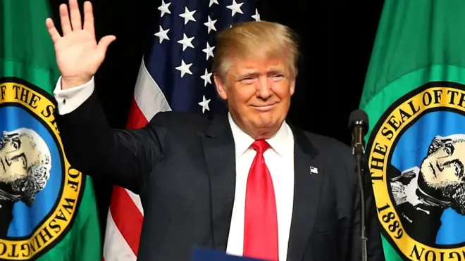 Donald Trump waves during a campaign rally in Spokane, Washington, 7 May 2016.