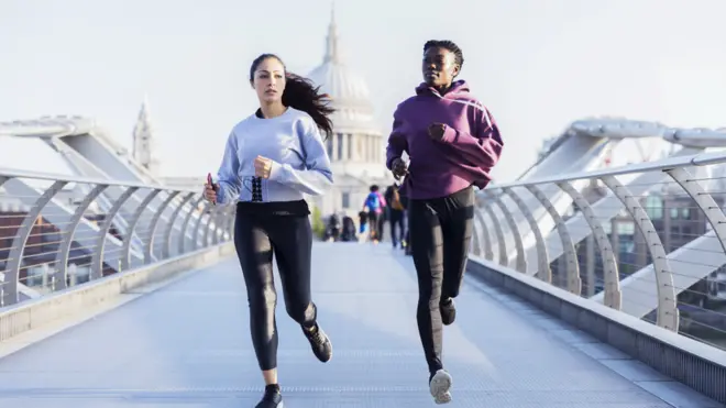Women jogging with St Paul's in the background