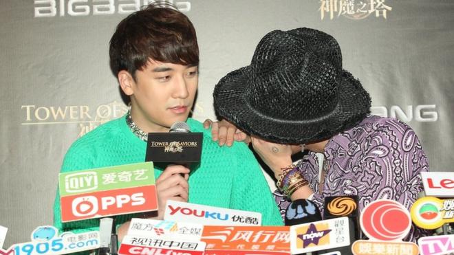 Seungri and G-Dragon of South Korean boy band Bigbang give a press conference in 2014