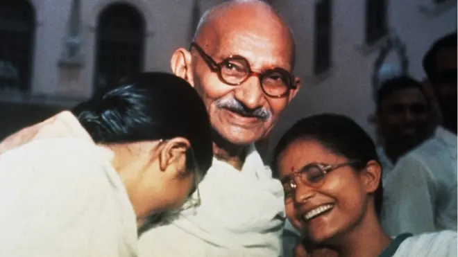 Mahatma Ghandi enjoys a laugh with granddaughters Manu (left) and Abha (right) at Birla House in New Delhi.