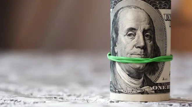 a roll of dollar bills