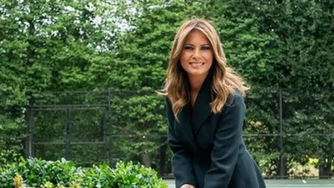 First Lady Melania Trump turns soil with a ceremonial shovel at the groundbreaking ceremony for the White House Tennis Pavilion on 8 October 2019
