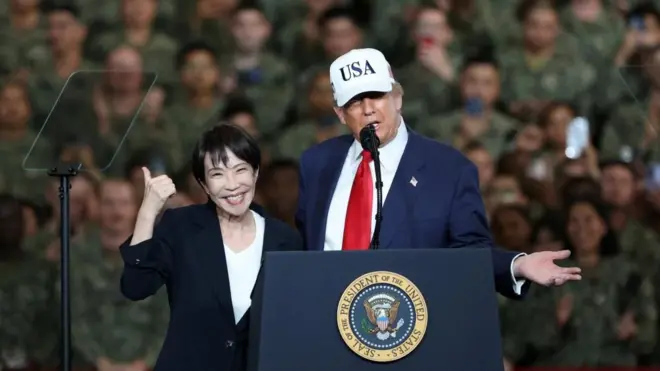 U.S. President Donald Trump speaks as Japanese Prime Minister Sanae Takaichi gestures